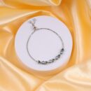 Sterling Silver Emerald Rhodium Charm Bracelet